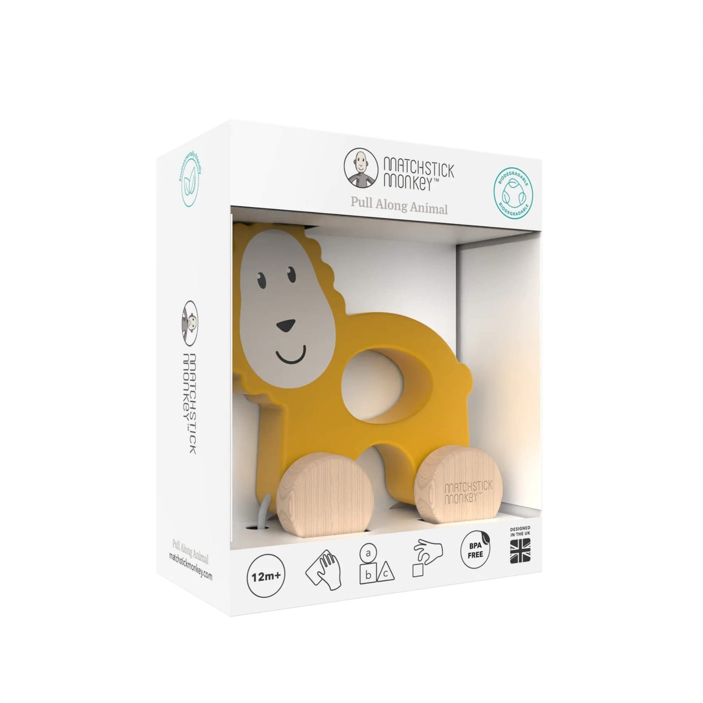 A boxed wooden lion pull-along toy shown inside a clear-front presentation box with illustrated icons around the base.