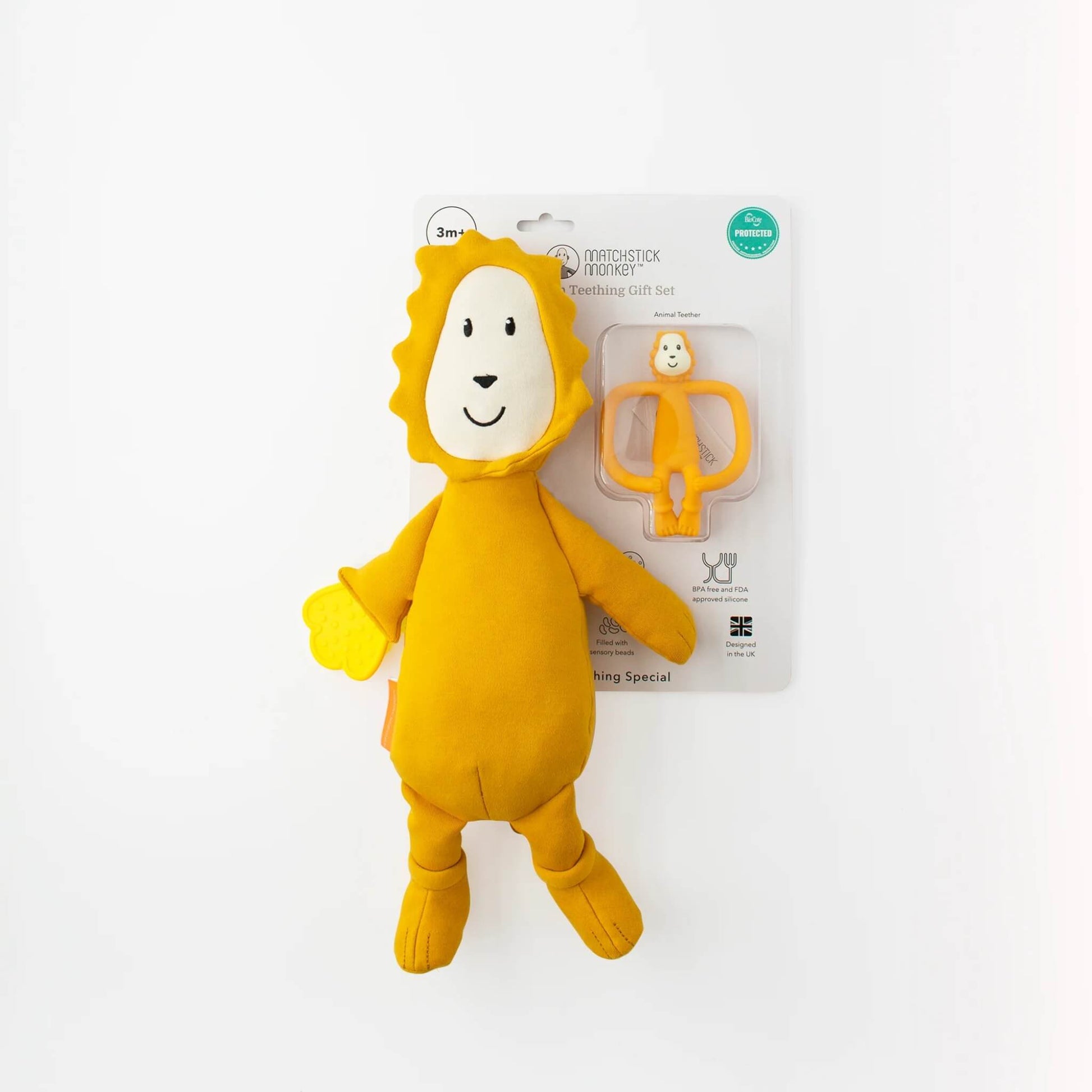 A soft lion sensory toy and silicone lion teether displayed in retail packaging against a white background.