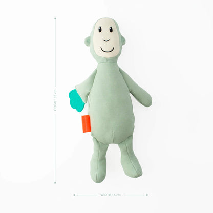 A soft green monkey sensory toy with attached textured teething leaf shown with dimensions measuring 35cm high and 15cm wide.