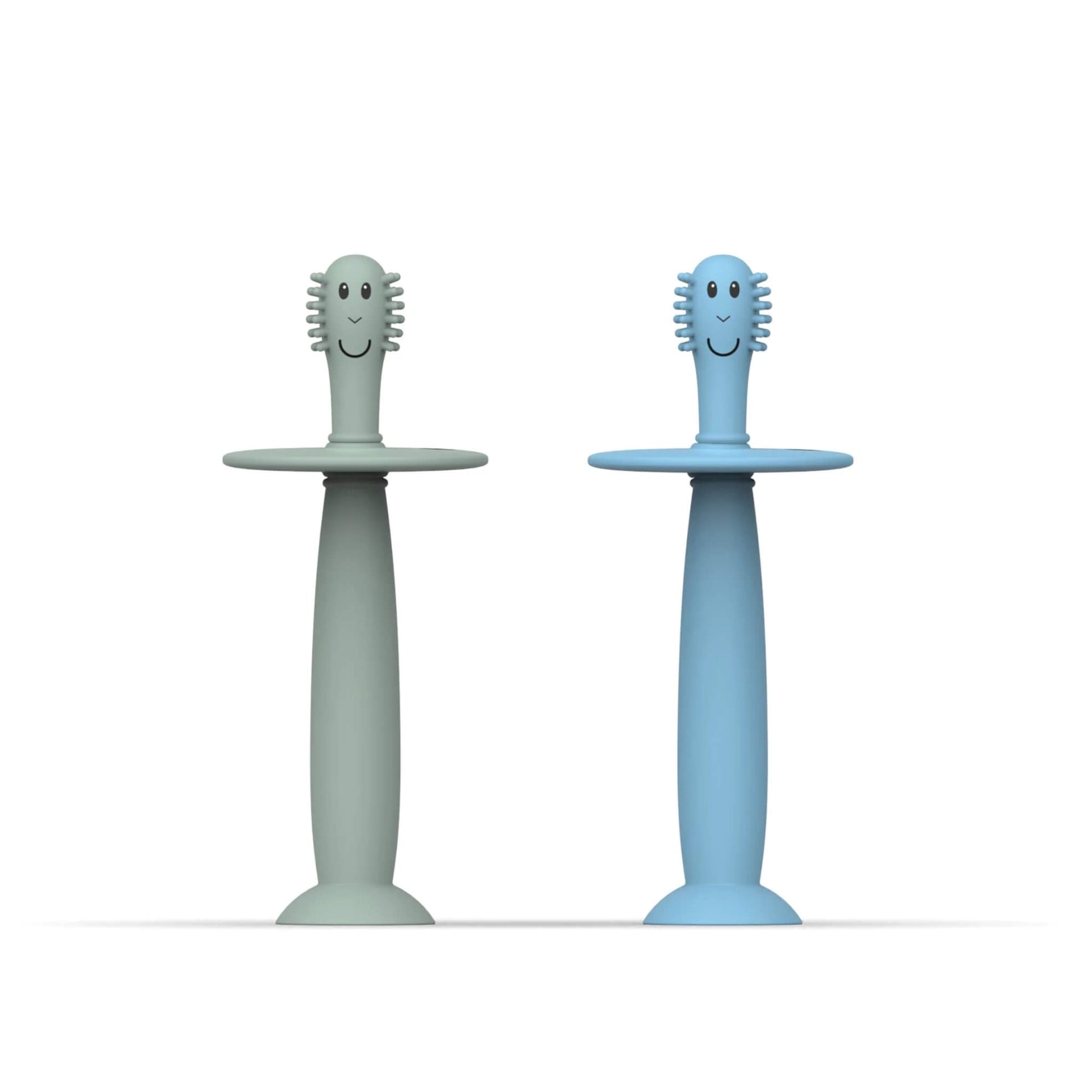 Matchstick Monkey Training Toothbrush with Stopper baby toothbrush set in mint green and light blue silicone with wide safety guards and suction cup bases.