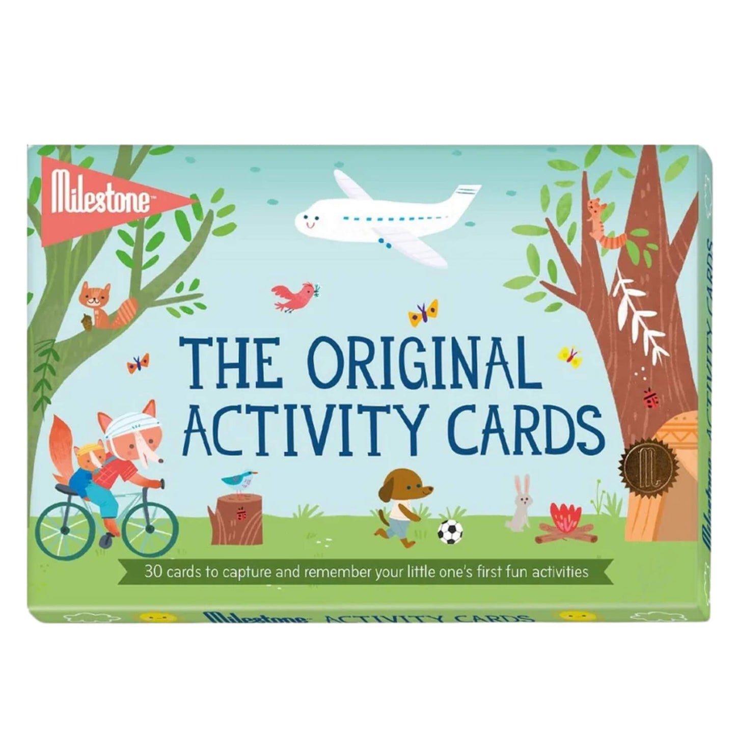 A box of Milestone The Original Activity Cards featuring playful woodland illustrations, an aeroplane, and the text ‘30 cards to capture and remember your little one’s first fun activities.