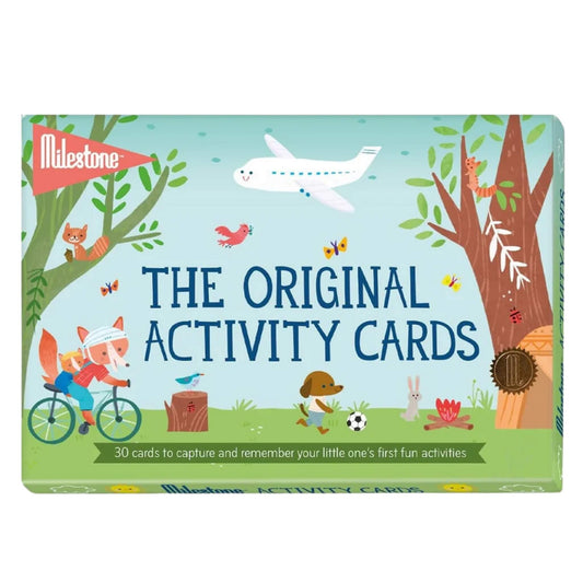 A box of Milestone The Original Activity Cards featuring playful woodland illustrations, an aeroplane, and the text ‘30 cards to capture and remember your little one’s first fun activities.