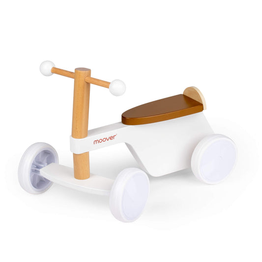 White Moover Bike wooden ride-on featuring a brown seat, smooth white frame, and four sturdy wheels, designed for toddlers learning to balance.