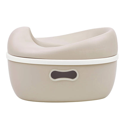 A Nattou 3-in-1 potty in beige shown fully assembled, with a smooth contoured seat and an oval handle cut-out on the base for easy lifting.