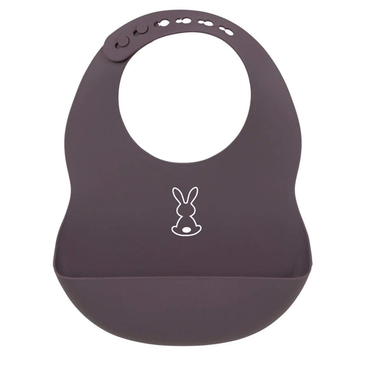 Purple Nattou silicone bib featuring an adjustable neck strap and a wide food-catching pocket, decorated with a simple bunny graphic for easy, mess-free feeding.