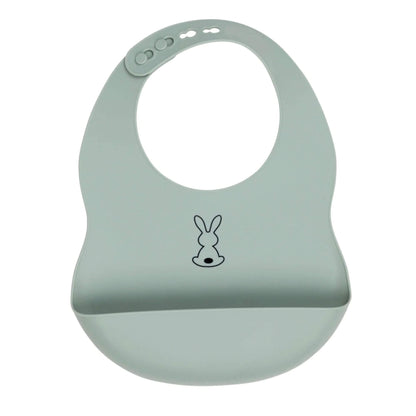 Sage green Nattou Silicone Bib shown laid flat, with its adjustable neck fastenings and deep food-catching pocket visible at the front.