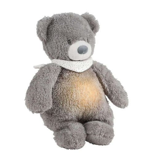 Nattou Sleepy cuddly bear nightlight with a gentle glow in its belly, wearing a white polka-dot scarf.