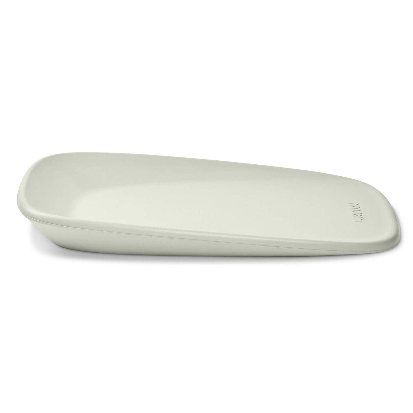 Side view of a soft green contoured changing pad with a gentle slope and smooth rounded edges.