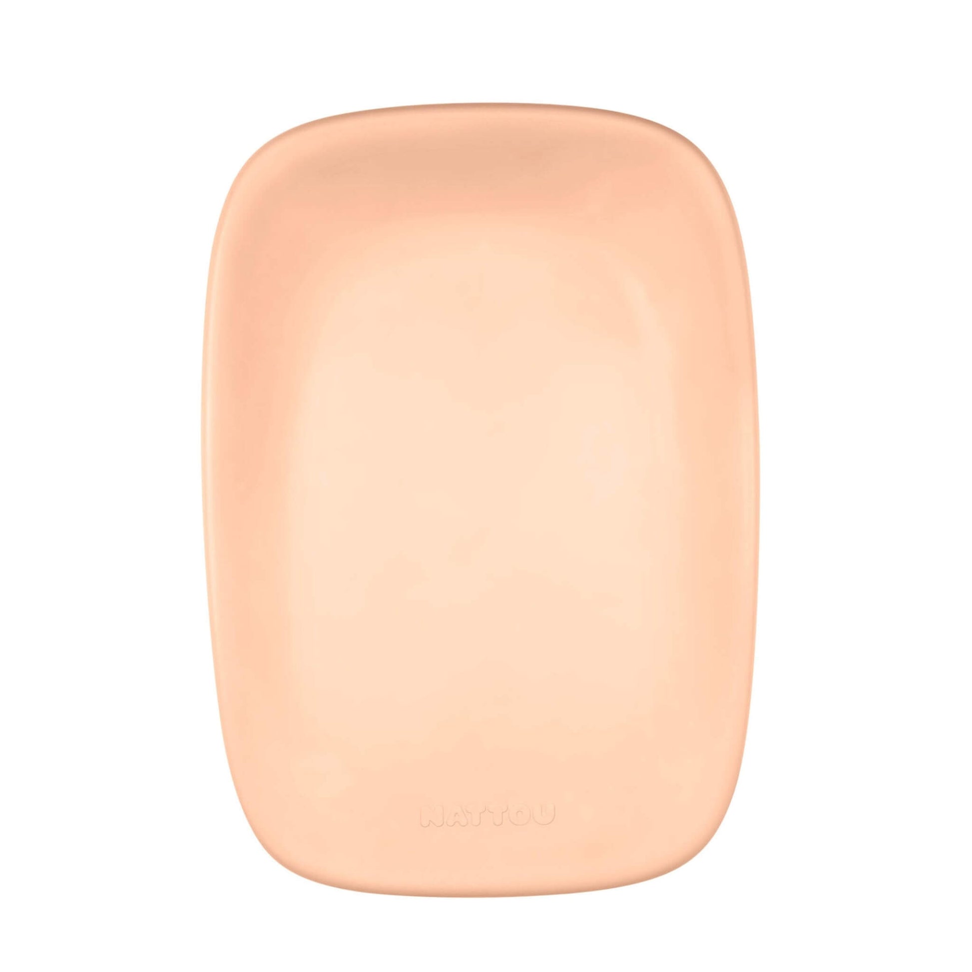 A top-down view of a peach coloured nappy changing pad with curved corners and a smooth recessed centre.
