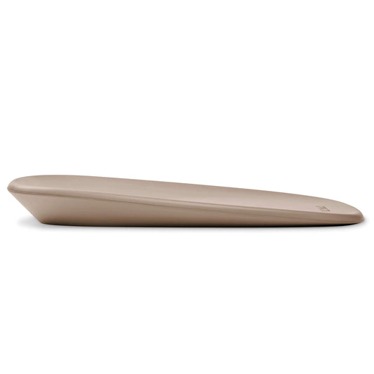 Side view of a taupe contoured changing pad with a gentle slope and smooth rounded edges.
