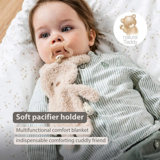 Baby lying down with an ecru plush bunny pacifier holder resting on their chest, shown with the text ‘Soft pacifier holder’, ‘Multifunctional comfort blanket’ and ‘indispensable comforting cuddly friend’ on the image.