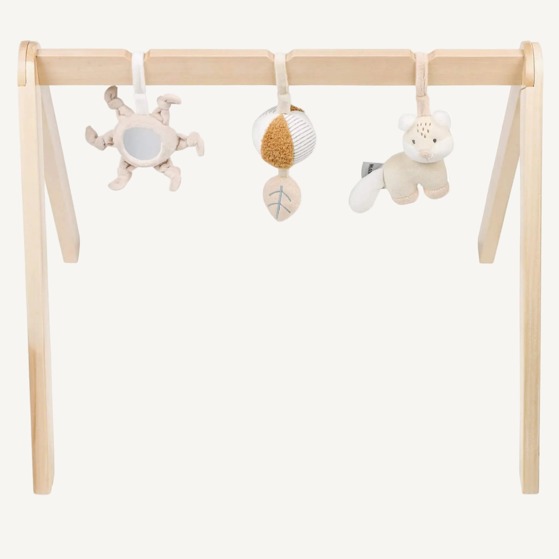Wooden baby play arch with three soft hanging sensory toys including a mirror sun, textured ball and plush animal, shown against a plain background.