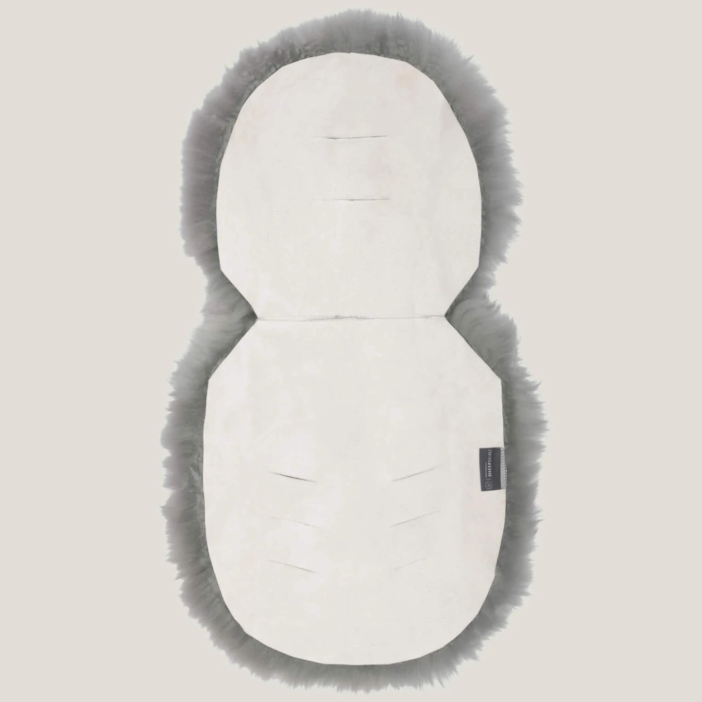 Reverse view of grey sheepskin pram liner showing cream suede backing with multiple harness openings.