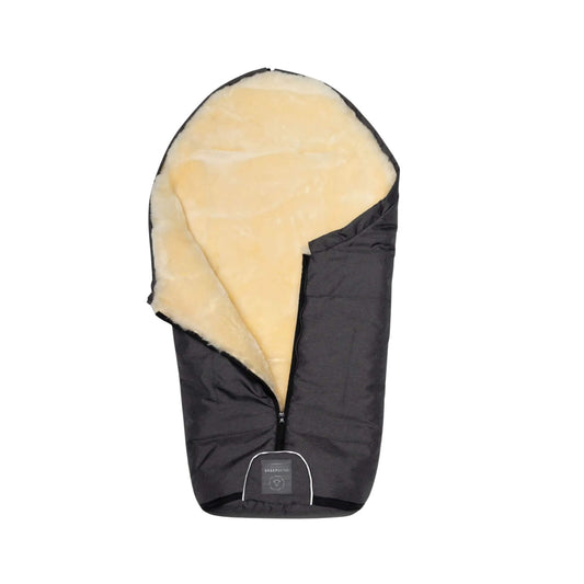 Black footmuff partially unzipped to reveal the cream sheepskin inner.