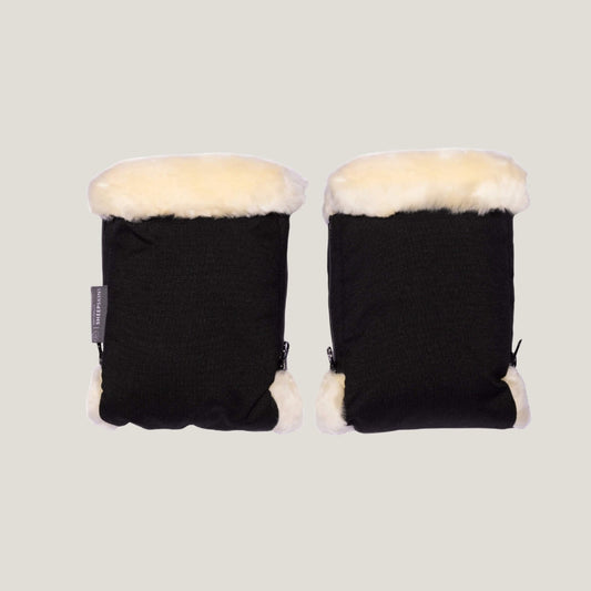 Pair of black stroller hand mittens placed side by side with cream sheepskin lining visible at the openings.