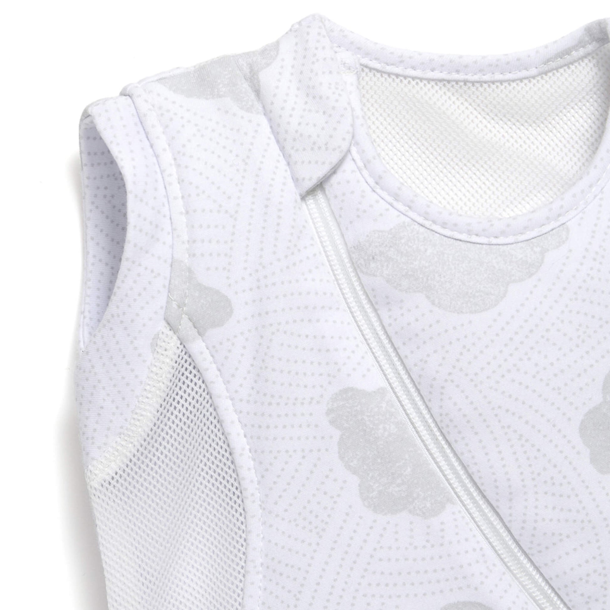 A detailed close-up of the shoulder area of a sleep bag, showing breathable mesh fabric, soft edging, and the cloud-patterned material.