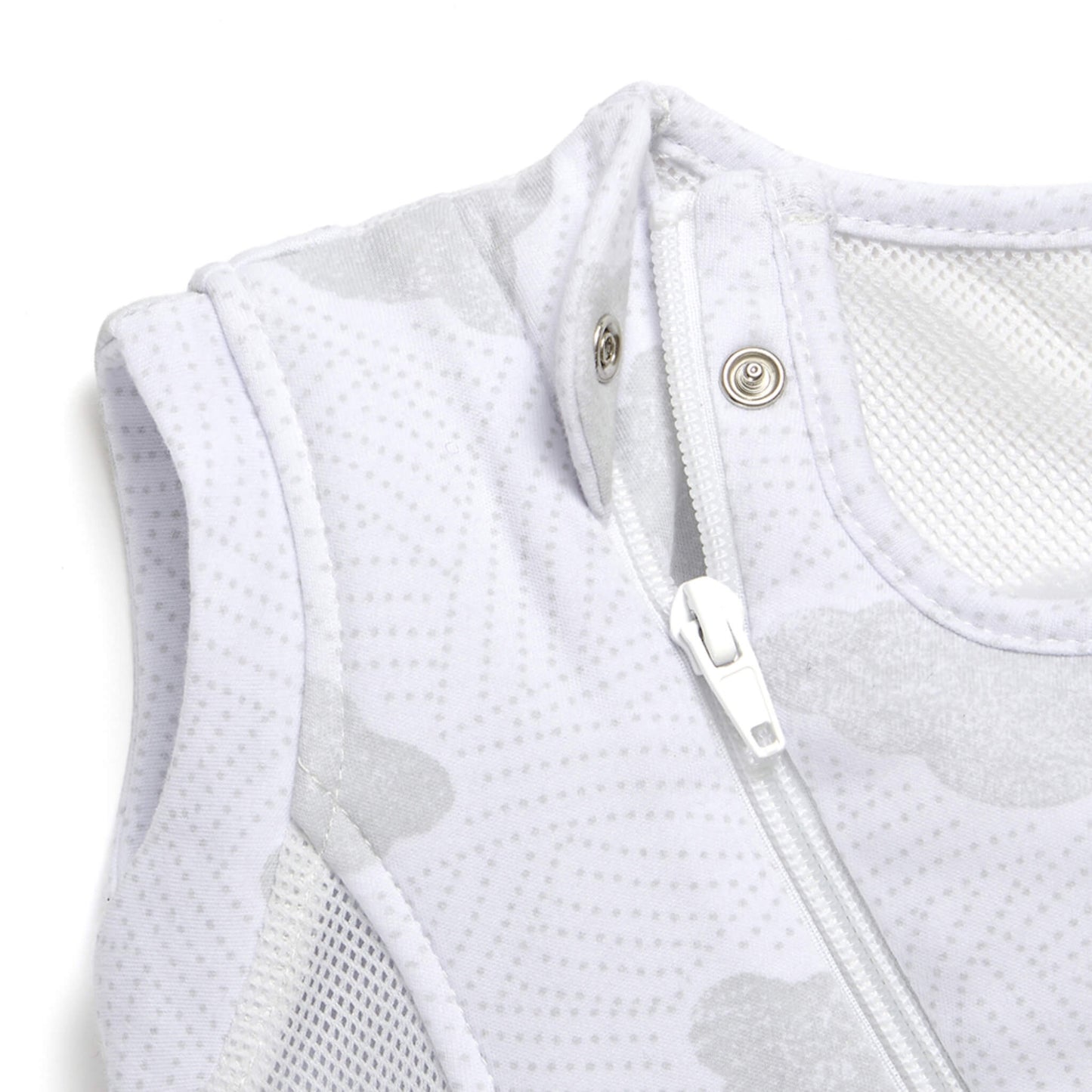 A close-up of the neckline and upper zip area on a sleep bag, showing a safety popper beside the zip and breathable mesh around the arm opening.