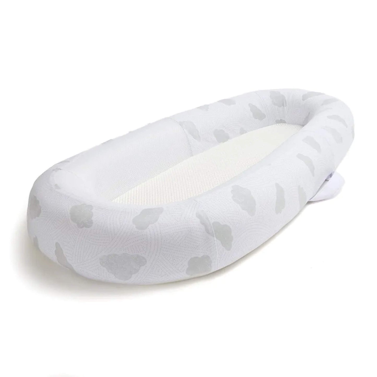 An angled view of a baby bed showing the oval shape and gently structured sides surrounding a flat sleep surface.