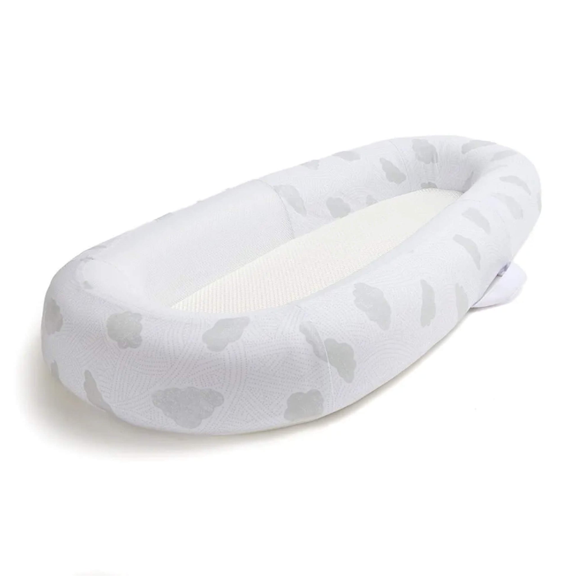 An angled view of a baby bed showing the oval shape and gently structured sides surrounding a flat sleep surface.