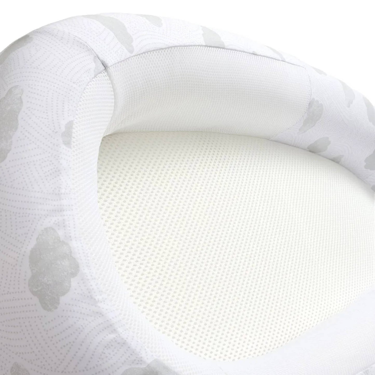 A close-up of the breathable mesh base and softly padded side panel with cloud pattern fabric.