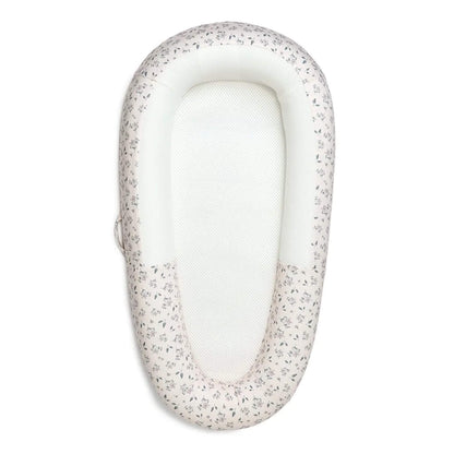 Purflo Sleep Tight Baby Bed in Daisy Dreams design with breathable mesh base and structured sides.