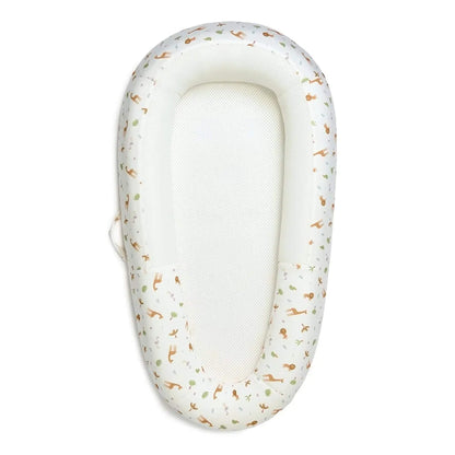 Purflo Sleep Tight Baby Bed with Savannah Slumber design shown from above with a white breathable mesh mattress and softly structured sides printed with safari animals.