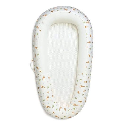 Purflo Sleep Tight Baby Bed with Savannah Slumber design shown from above with a white breathable mesh mattress and softly structured sides printed with safari animals.