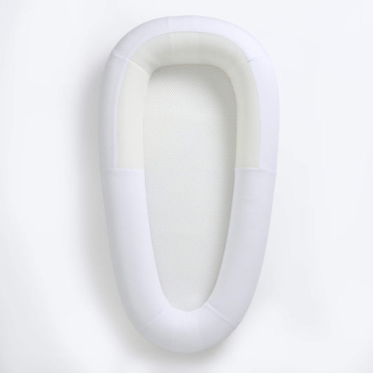 Purflo Sleep Tight Baby Bed in Soft White with breathable mesh base and structured sides, shown from above as a clear, open resting space for baby.
