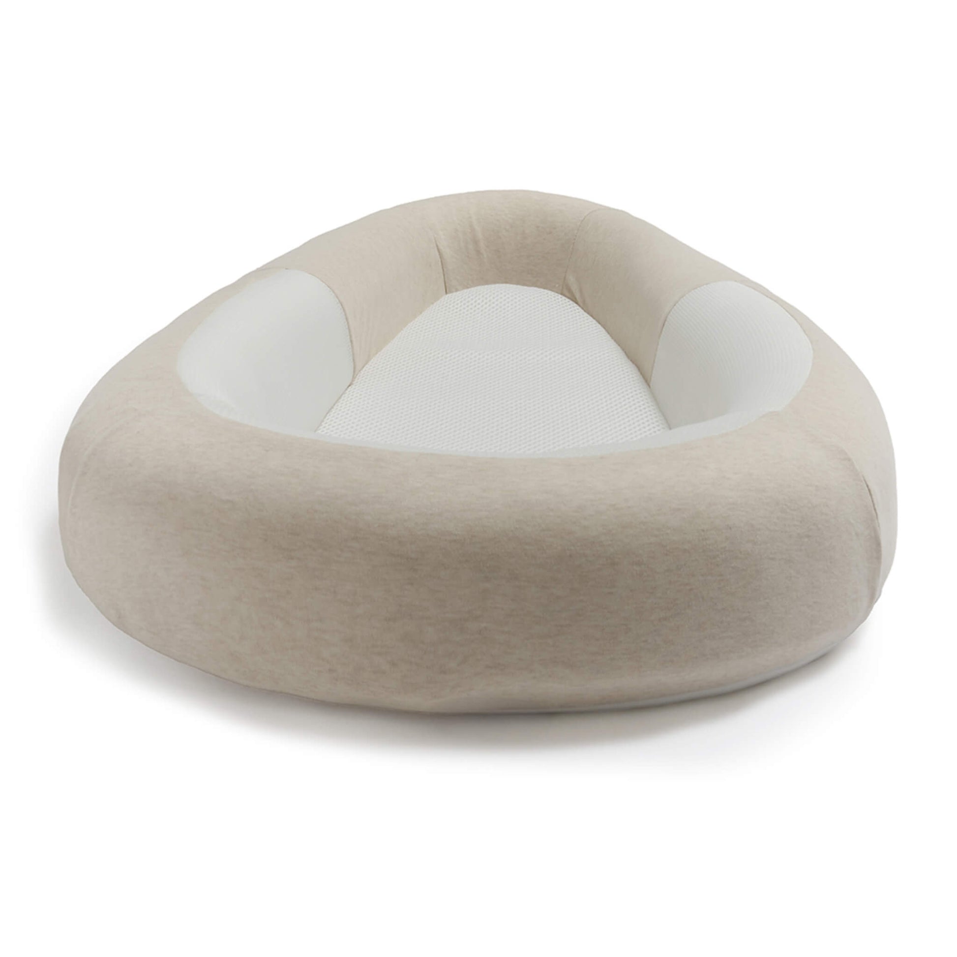 A front view of a baby bed showing the raised padded surround and breathable mesh mattress.