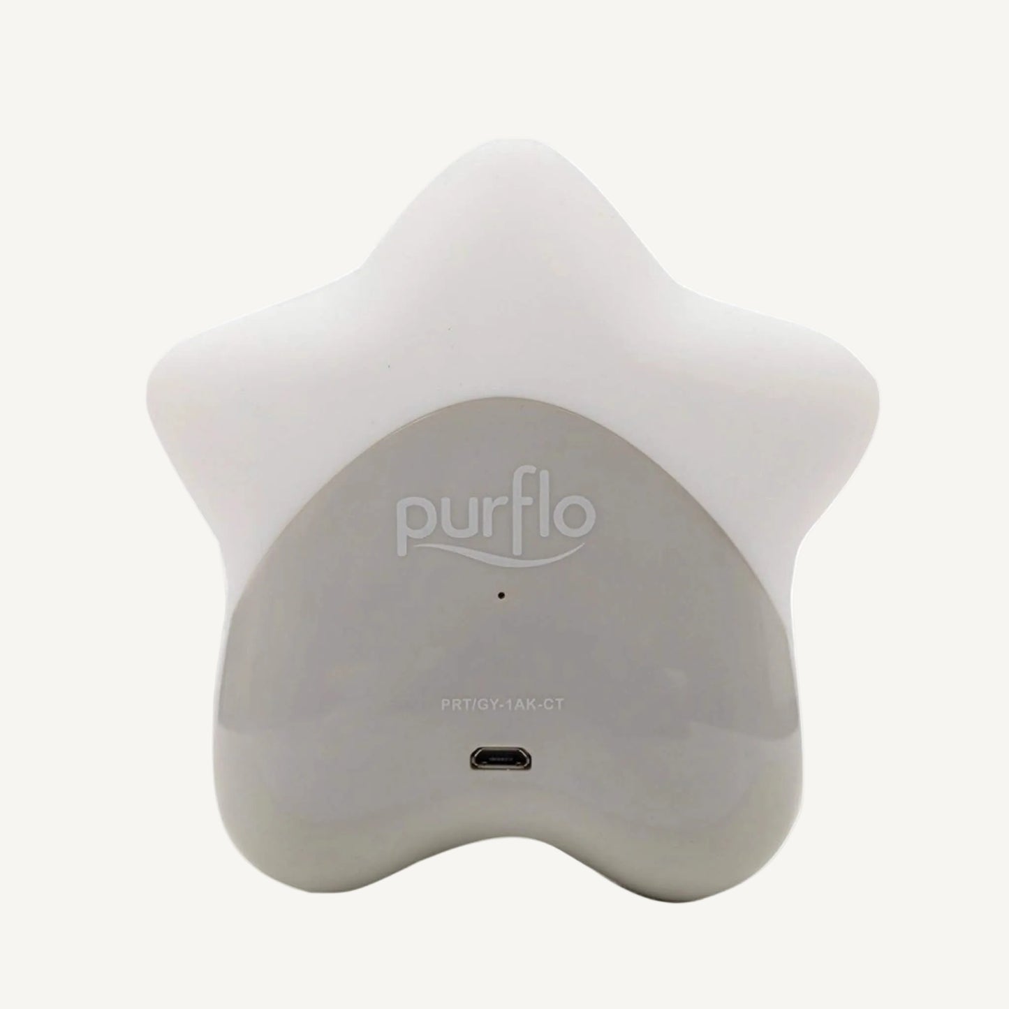 Rear view of a star-shaped room thermometer showing charging port and smooth matte finish.