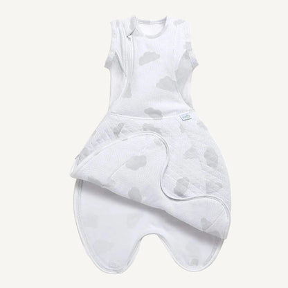 Swaddle sleep bag laid flat, opened at the bottom, showing full shape with enclosed feet, quilted lower body and pale grey cloud print fabric.