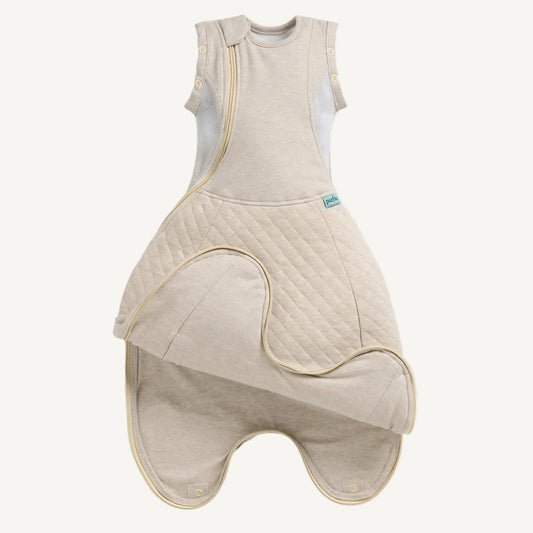 A beige baby sleep bag laid flat showing a quilted lower section and smooth upper body.
