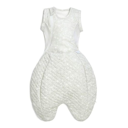 Purflo Swaddle to Sleep Bag 2.5 TOG in the Magical Garden design, shown laid flat with quilted lower section, breathable mesh side panels, and a curved zip for night-time changes.