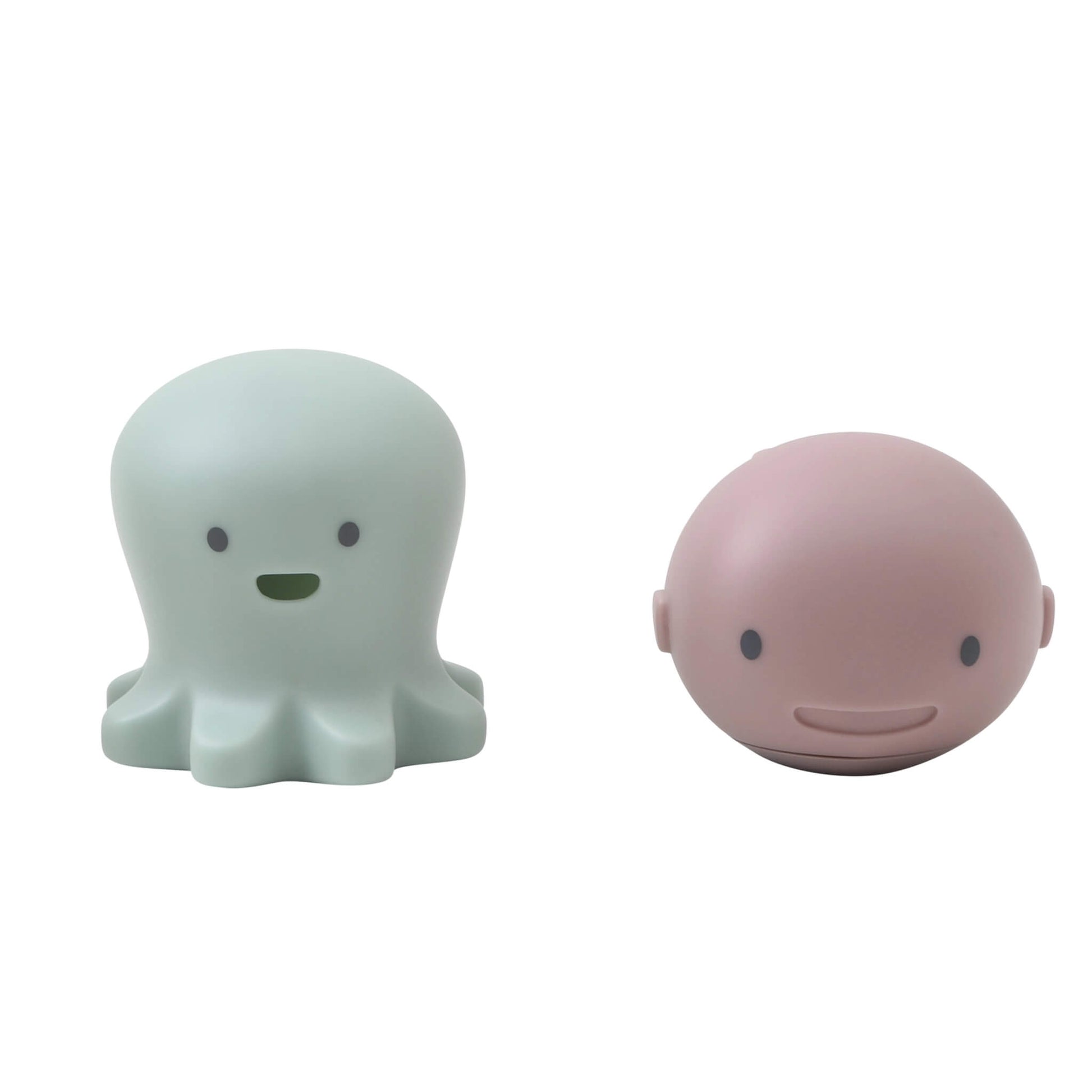 A set of Shnuggle Bath Buddies featuring a mint octopus toy and a pink whale toy with smiling faces, designed for interactive baby bath time fun.