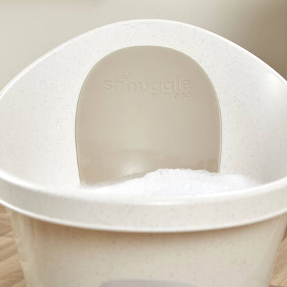 Interior view of a baby bath with soft bubbles inside and an embossed eco back panel.