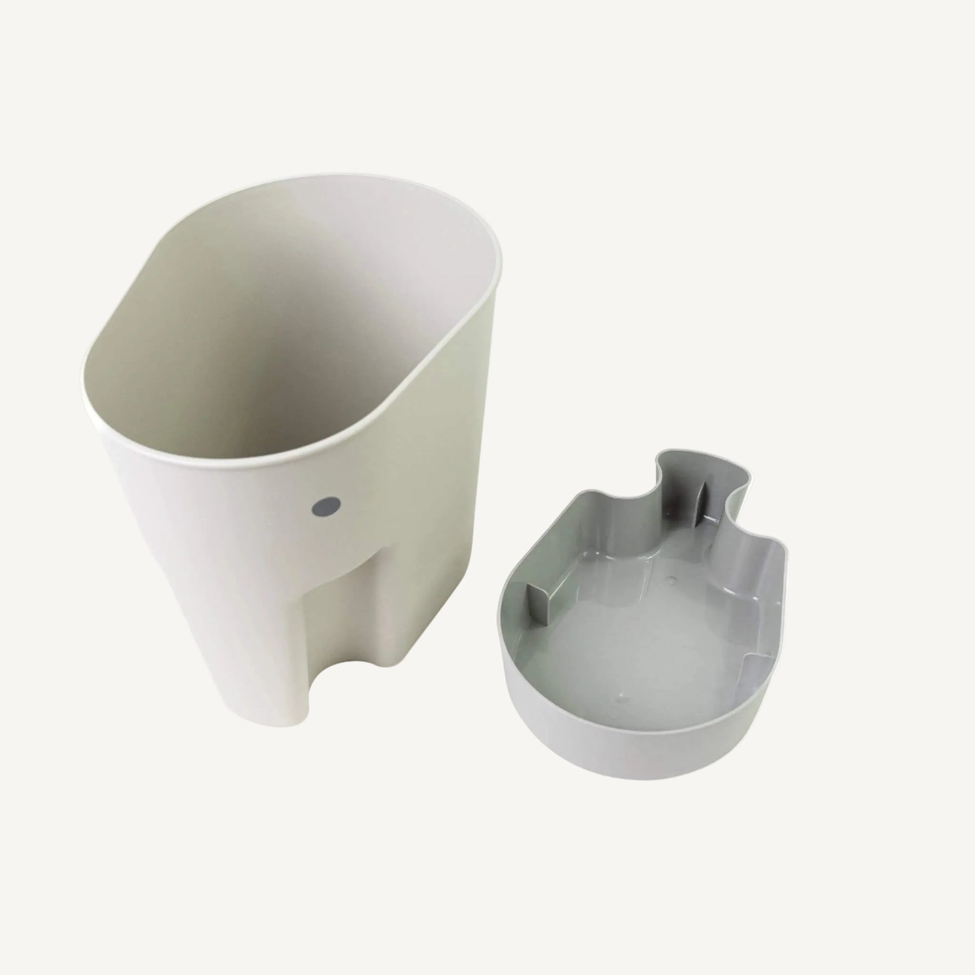 A grey elephant-shaped bath toy drying caddy shown with a separate drip tray placed beside it on a plain background.