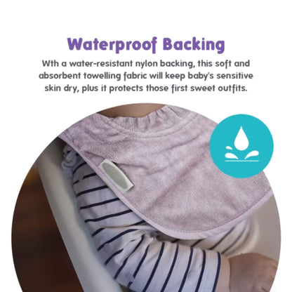 A close-up of a bib worn over a striped top, showing the smooth outer surface and how the curved edge rests flat against clothing.