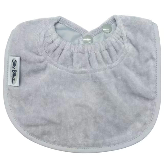 Grey towelling baby bib with soft absorbent fabric, gathered neckline and two popper snap fastenings at the shoulder, shown flat on a plain background.