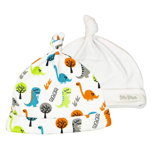 Silly Billyz™ Gumnut Baby Hat 2-Pack featuring a dinosaur print knotted jersey cotton hat and a plain white knotted baby hat, shown side by side on a white background.