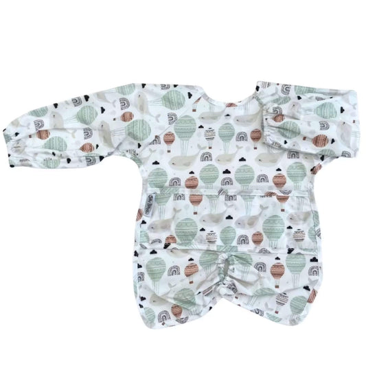 Silly Billyz long sleeve highchair bib in Floating Whales print. Full-length sleeves and easy wipe-clean surface for full coverage during baby feeding.