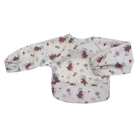 Silly Billyz wipe clean long sleeve bib with food-catching pocket in Mr Hedgehog print. Full coverage baby bib with waterproof front and elasticated cuffs.