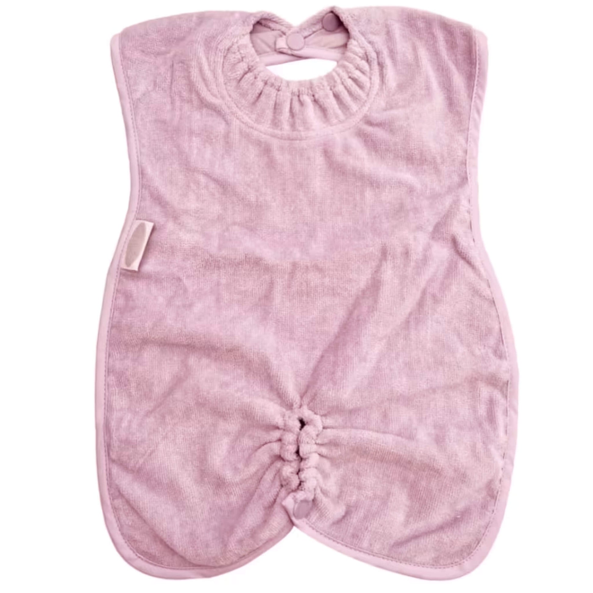 Silly Billyz Highchair Hugger Towel Bib in Antique Pink, showing a soft towelling bib with elasticated neck opening, popper fastening at the back, and a gathered base designed to catch dropped food during highchair meals.