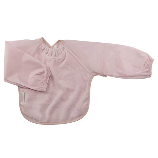 Silly Billyz Towel Long Sleeve Bib in antique pink, shown laid flat with full-length water-resistant sleeves, a soft cotton towelling front, gathered neckline, and a snap closure at the back for easy dressing and extra coverage during feeding.