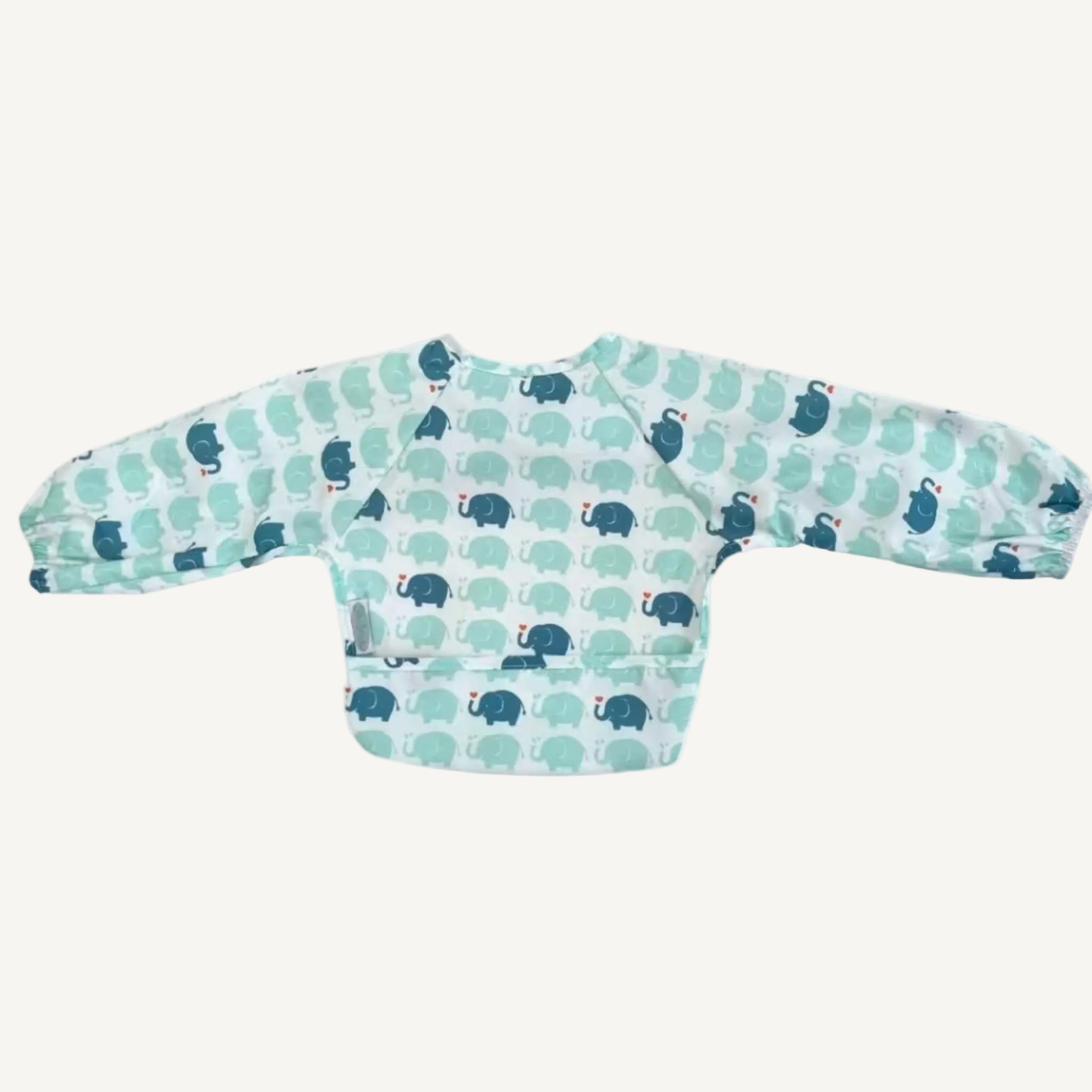 A long-sleeve bib in a repeating elephant pattern shown laid flat from the back, with elasticated cuffs and a smooth wipe-clean surface.