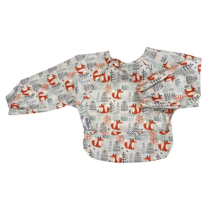A Silly Billyz Wipe Clean Long Sleeve Bib in the Mr Fox print shown laid flat, with elasticated cuffs and a front pocket across the lower edge.