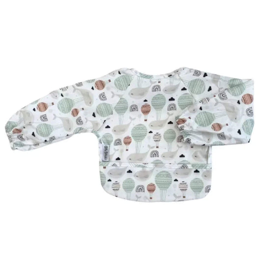 Silly Billyz Wipe Clean Long Sleeve Bib in Floating Whales print, featuring full arm coverage, shaped front and wipe-clean waterproof fabric.