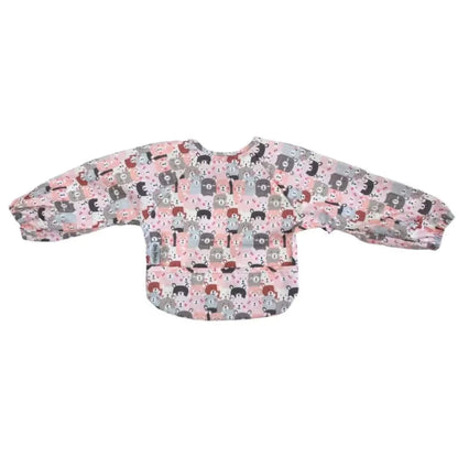 Long sleeve wipe-clean baby bib displayed flat with extended sleeves and front food-catching pocket in Peekaboo print.