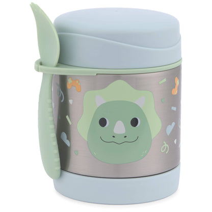 A stainless steel childrens lunch container with a light blue lid and base, featuring a green dinosaur face graphic and small colourful doodles on the front. A matching light green spoon is tucked into the side of the container.