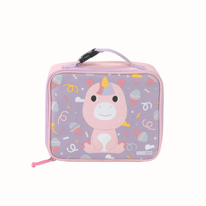 A pink and lavender zippered lunch bag with a cartoon unicorn design on the front, featuring a top handle and a small SKIP HOP brand label.