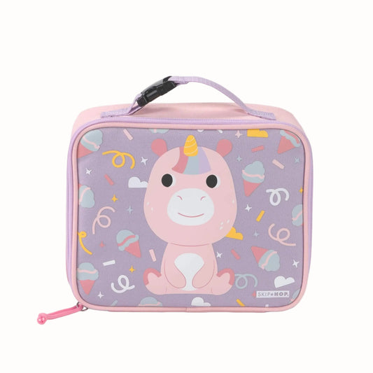 A pink and lavender children's lunch bag featuring a cute cartoon unicorn on the front, with a top handle and a small visible Skip Hop logo in the bottom right corner.